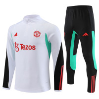 Манчестер Юнайтед детский тренировочный костюм 2023-2024 бело-чёрный с красным и бирюзовым